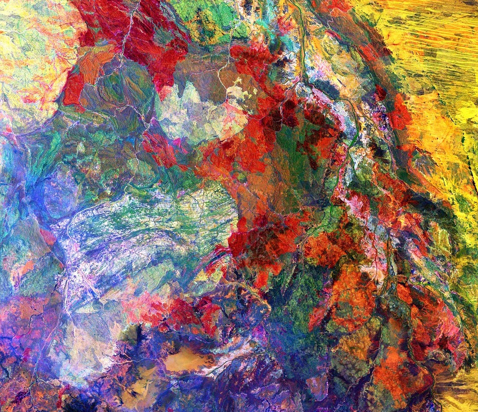 "This enhanced image of Western Australia resembles a mixture of crayons that melted in the sun. The yellow sand dunes of the Great Sandy Desert cover the upper right portion of the image. Red splotches indicate burned areas from grass and forest fires, and the colors in the rest of the image depict different types of surface geology." - USGS